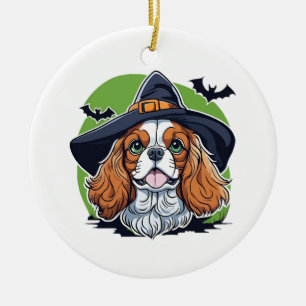 A dog wearing a witches hat with bats ceramic ornament