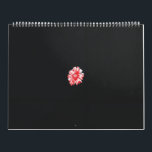 a drawing of a red flower on a white background calendar<br><div class="desc">The design features a graphic representation of a flower with numerous petals. The petals are depicted with red scribble-like strokes, giving the impression of a sketch or an abstract painting. In the centre, there is a circular pattern in shades of pink and purple that suggests the flower’s core. The background...</div>