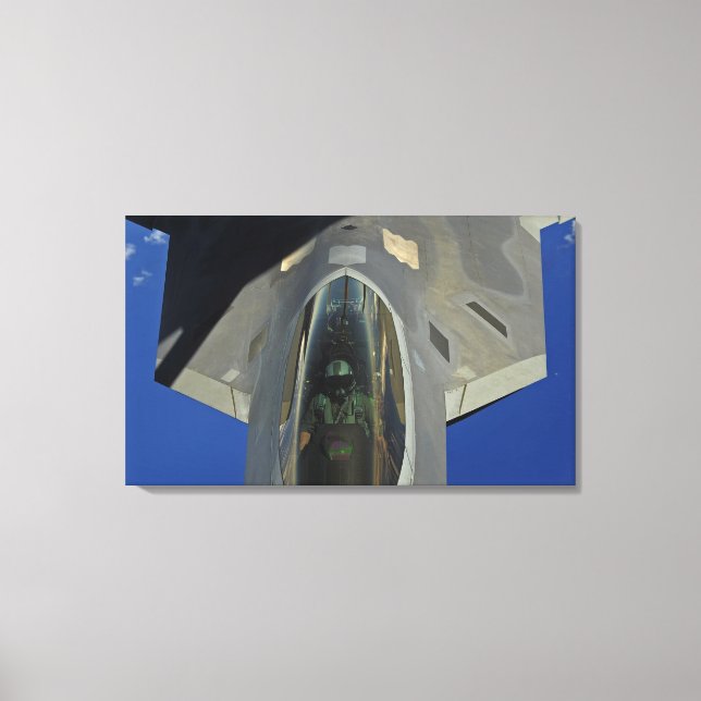 A F-22 Raptor receives fuel from a KC-135 Canvas Print (Front)