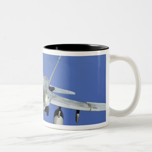 A F/A-18 Hornet participates in a mission Two-Tone Coffee Mug (Right)