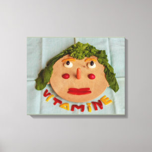 a face of vegetables on wrapped canvas