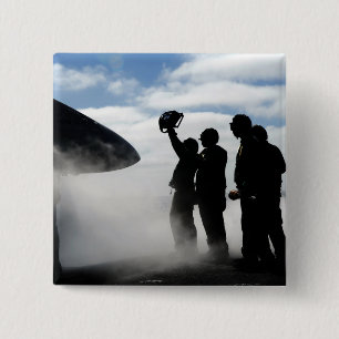 A flight deck crew member 2 inch square button