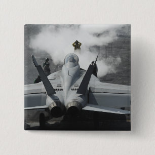 A flight deck director signals an F/A-18F 2 Inch Square Button