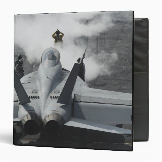 A flight deck director signals an F/A-18F Binder (Front/Inside)