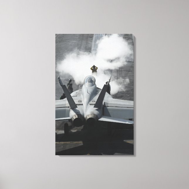 A flight deck director signals an F/A-18F Canvas Print (Front)