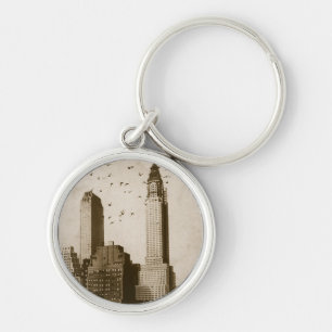 A flock of birds flying keychain