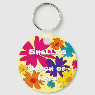 A floral bed of daisy flowers keychain