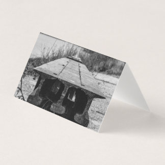 A forgotten old rail seat along a river.