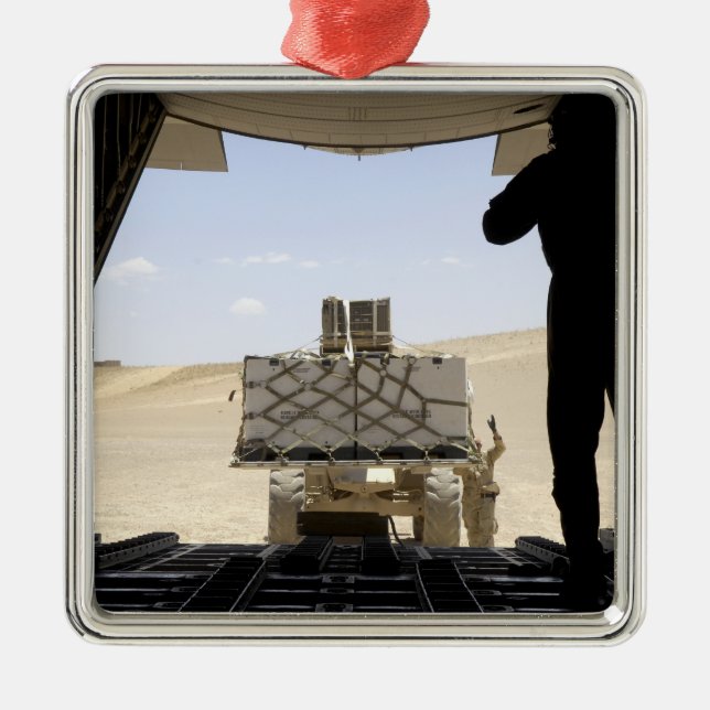 A forklift loads cargo onto a C-130 Hercules Metal Ornament (Front)