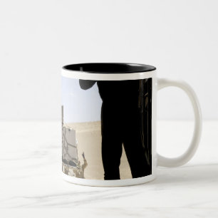 A forklift loads cargo onto a C-130 Hercules Two-Tone Coffee Mug