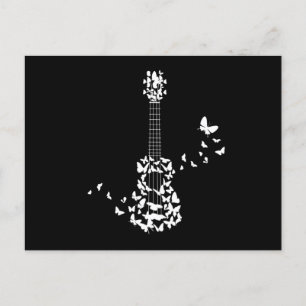 A Four String Ukulele Instrument With Beautiful Postcard
