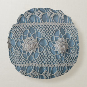 A fragment of a wide lace insert contains small wh round pillow