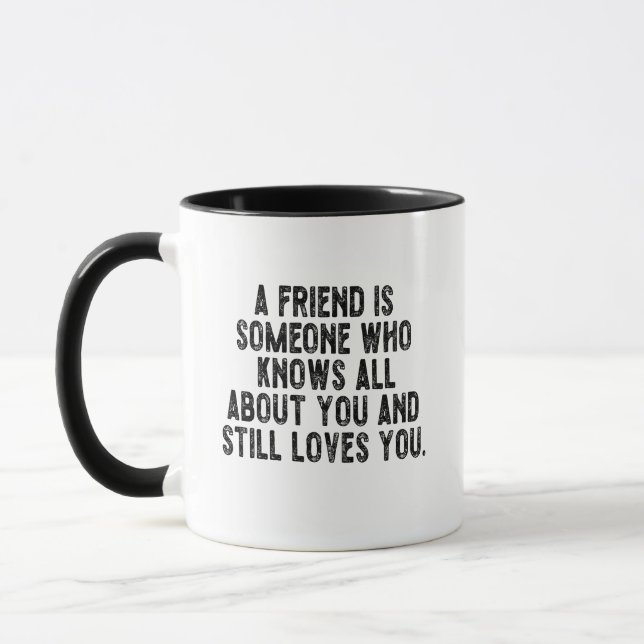 A friend is someone who knows all about you and st mug (Left)