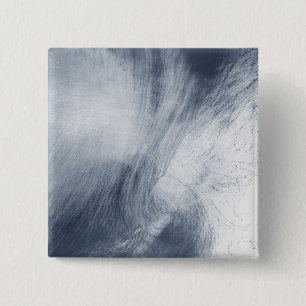 A giant whirlpool cloud swirls above the sea 2 inch square button
