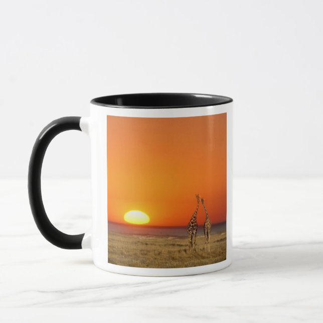 A Giraffe couple walks into the sunset, in Mug (Left)