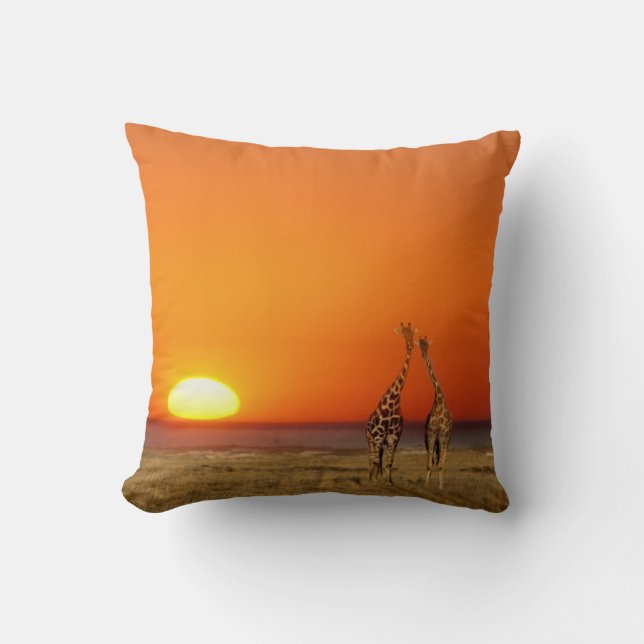 A Giraffe couple walks into the sunset, in Throw Pillow (Front)