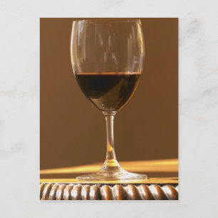A glass of red Chateau Belgrave in sunlight - Postcard