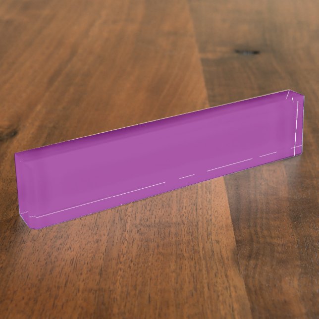 A gradient background blending shades of pink and  nameplate (Side)