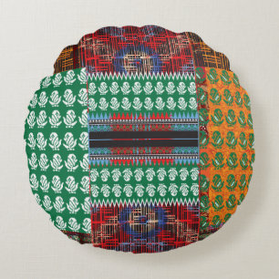 a green and black pattern with a tree in the middl round pillow