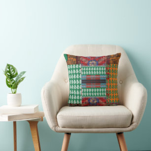 a green and black pattern with a tree in the middl throw pillow