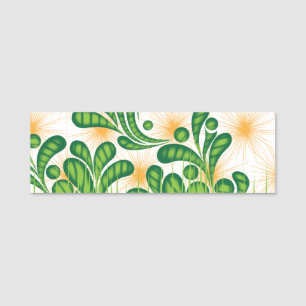 A green and gold artistic pattern depicting a tree name tag