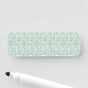 a green and white background with small leaves name tag