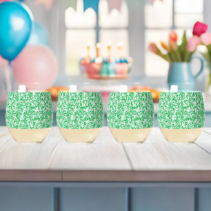 a green and white background with small white dots stemless wine glass