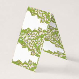 a green and white wallpaper with ornate designs business card