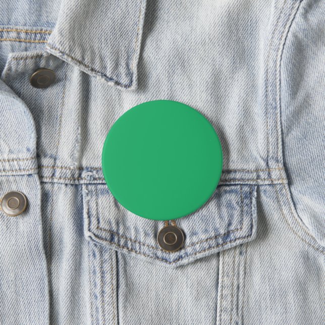 a green background with a white border 3 inch round button (In Situ)