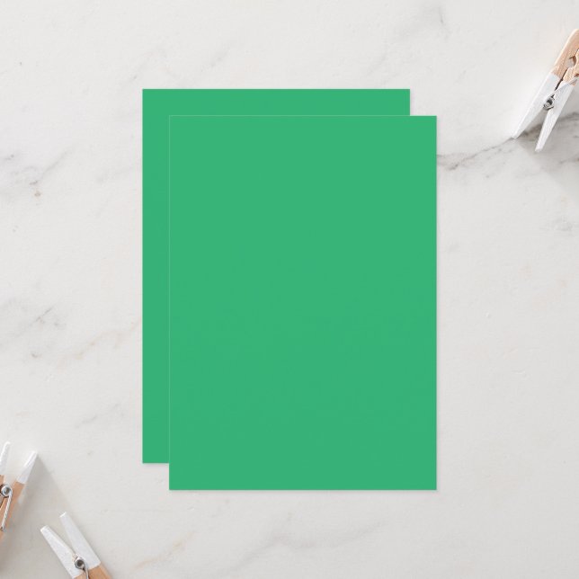 a green background with a white border invitation (Front/Back In Situ)