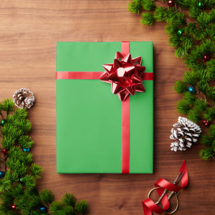 a green background with a white border wrapping paper