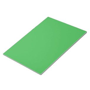 a green backgrounds with a white border notepad