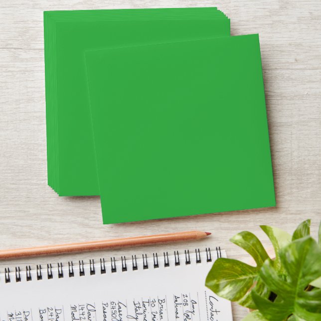 a green screen with a white background envelope (Stacked)