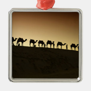 A group of camel herders with their camels metal ornament
