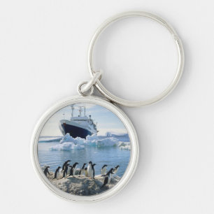A Group Of Penguins Standing On An Icy Beach Keychain