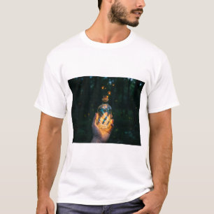 A hand holding a bottle of light in night T-Shirt