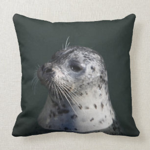 A harbour seal throw pillow