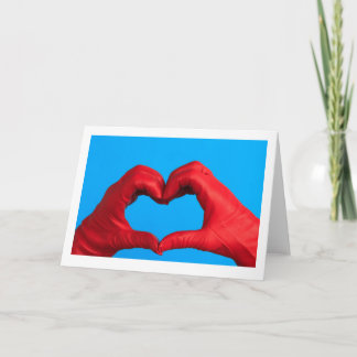 A HEART OF RED LEATHER GREETING CARD