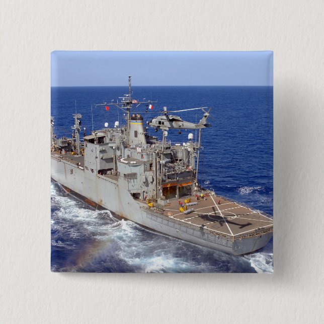 A helicopter clears the flight deck 2 inch square button (Front)