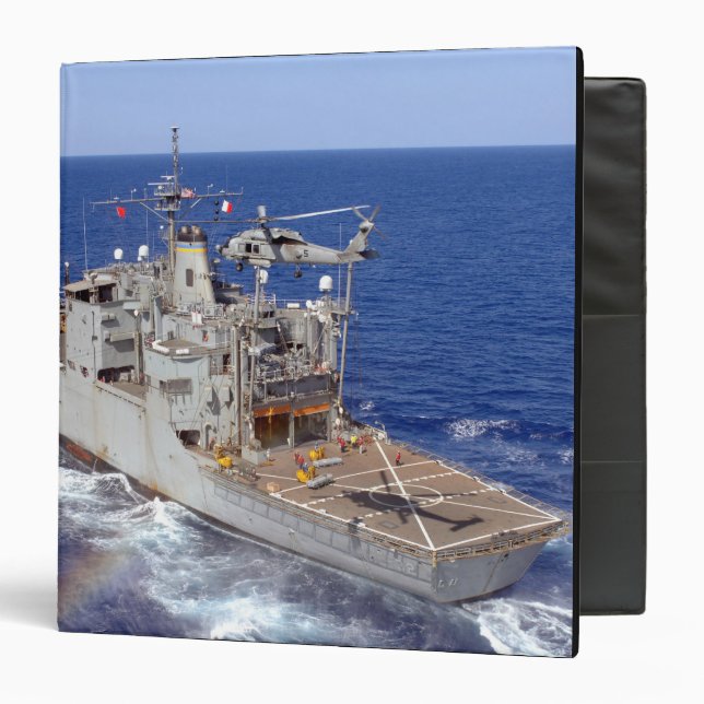 A helicopter clears the flight deck binder (Front/Inside)