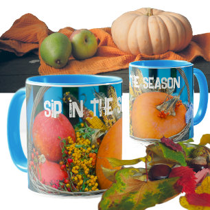 A holiday basket with pumpkins mug