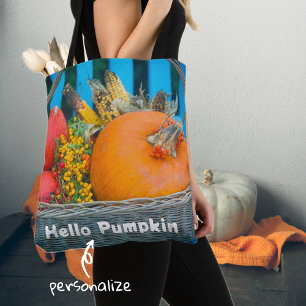 A holiday basket with pumpkins  tote bag