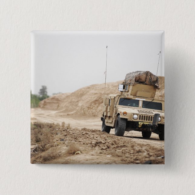 A Humvee conducts security 2 Inch Square Button (Front)