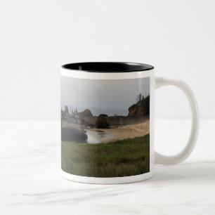 A landing craft air cushion comes ashore Two-Tone coffee mug