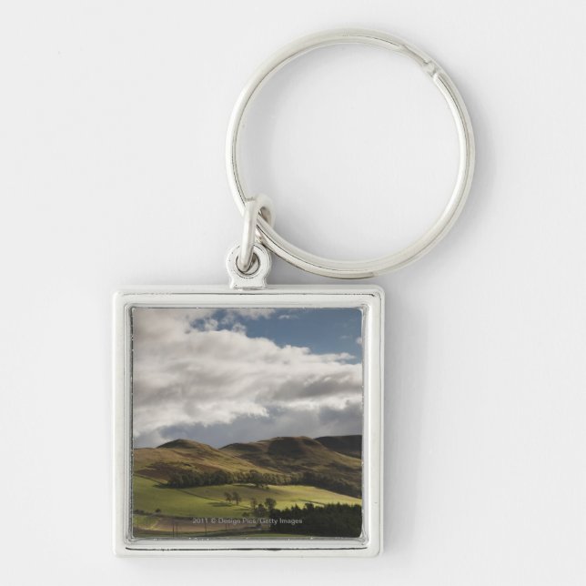 A Landscape With Rolling Hills And Clouds Overhead Keychain (Front)