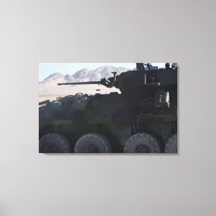 A light armoured vehicle fires canvas print