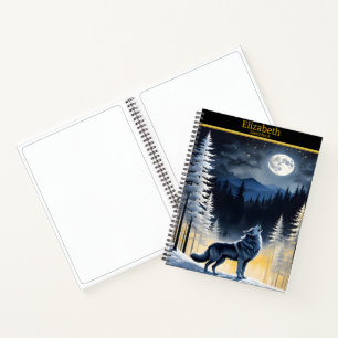 A lone wolf howling at the full moon in winter notebook