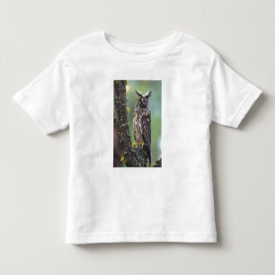 A long-eared owl perched on a tree branch toddler t-shirt