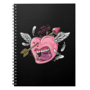 a love heart with lips and wings that are hit by l notebook