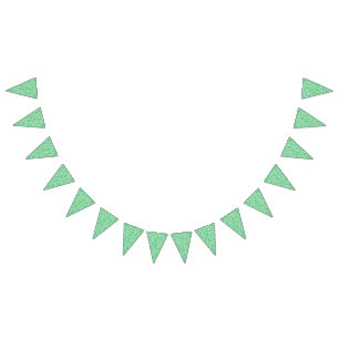 A lush, green fern with delicate, arching fronds f bunting flags